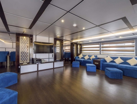saloon area with tv on board the dive boat